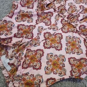 Floral design flowy top with adjustable tying in the front